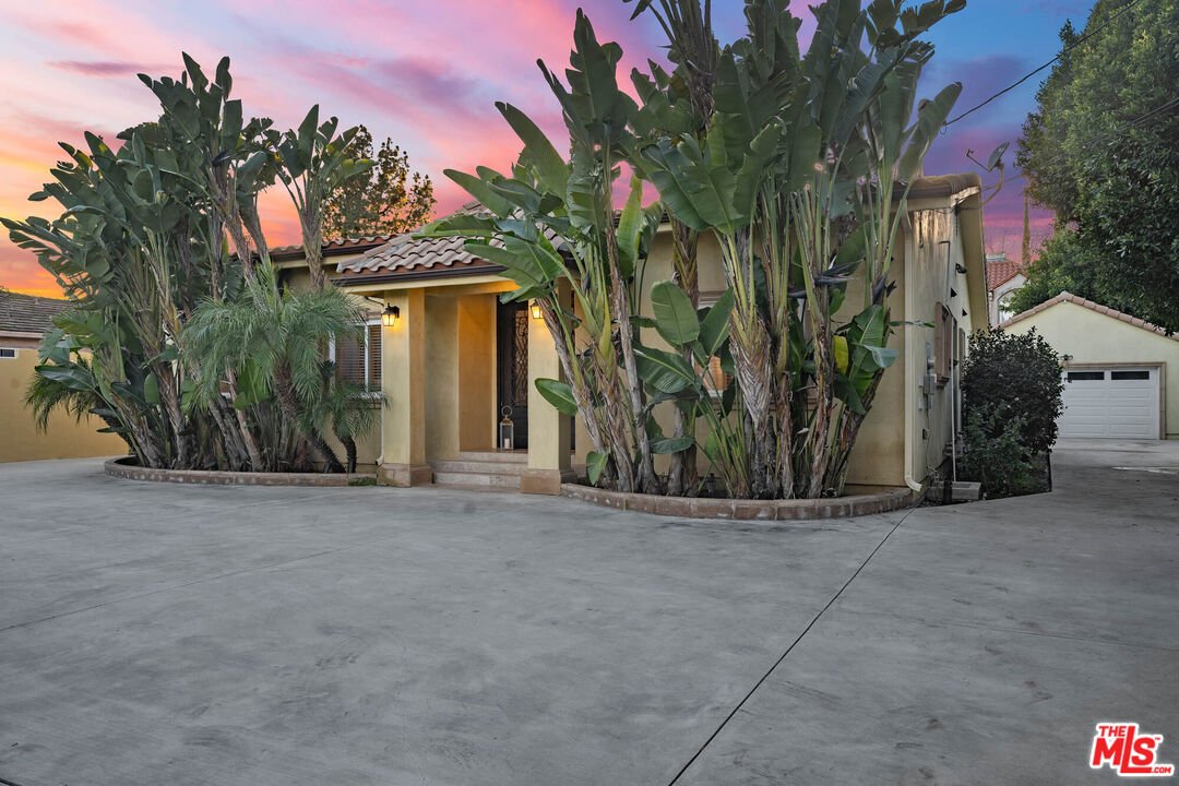 5181 Densmore Avenue Encino, CA 91436 - Photo 27 of 73 a view of a house with a plants and trees