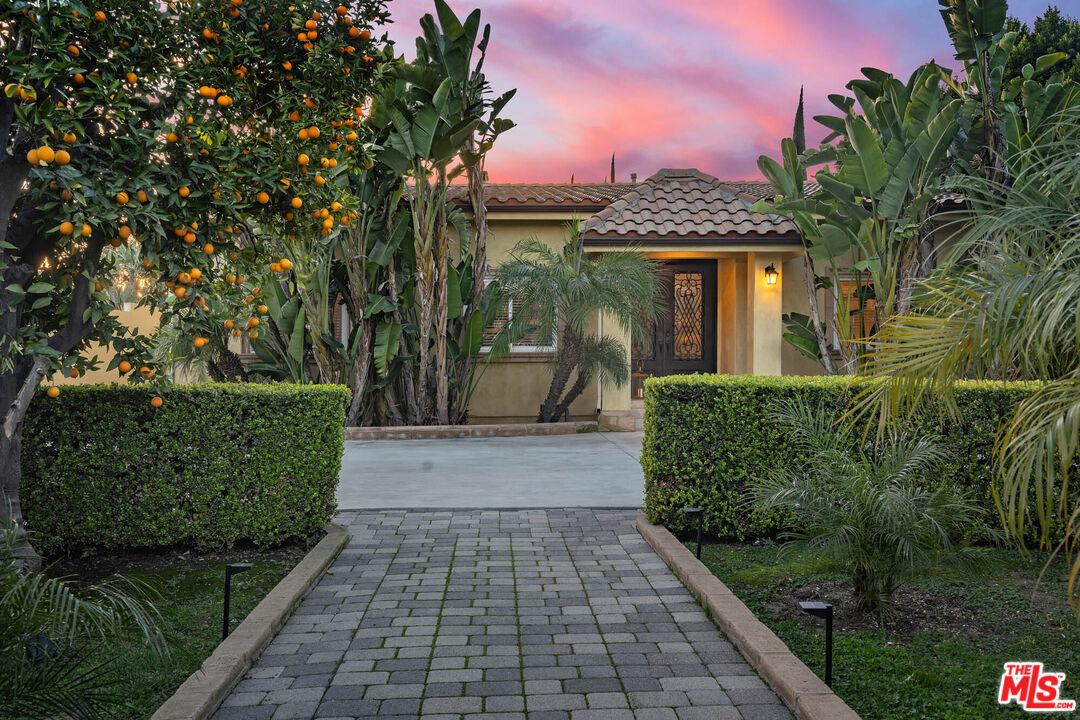 5181 Densmore Avenue Encino, CA 91436 - Photo 30 of 73 a front view of a house with a yard