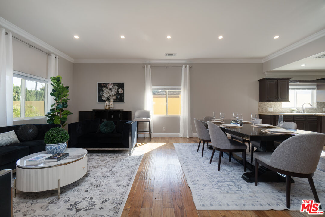 5181 Densmore Avenue Encino, CA 91436 - Photo 35 of 73 a living room with furniture and a rug