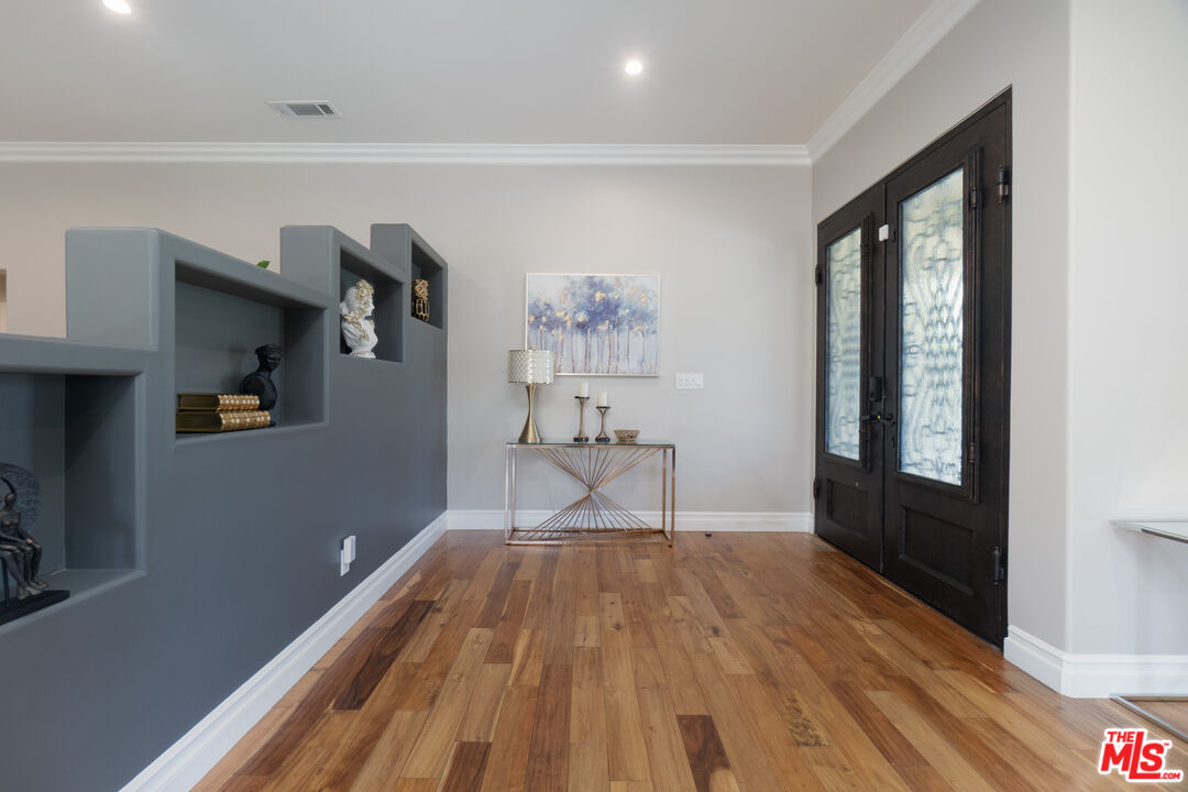 5181 Densmore Avenue Encino, CA 91436 - Photo 40 of 73 a living room with furniture and a window
