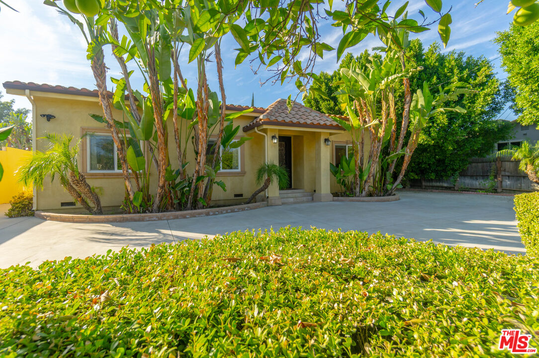 5181 Densmore Avenue Encino, CA 91436 - Photo 4 of 73 a front view of a house with a yard