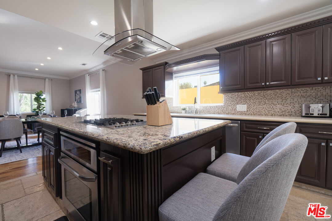 5181 Densmore Avenue Encino, CA 91436 - Photo 45 of 73 a kitchen with granite countertop lots of counter top space