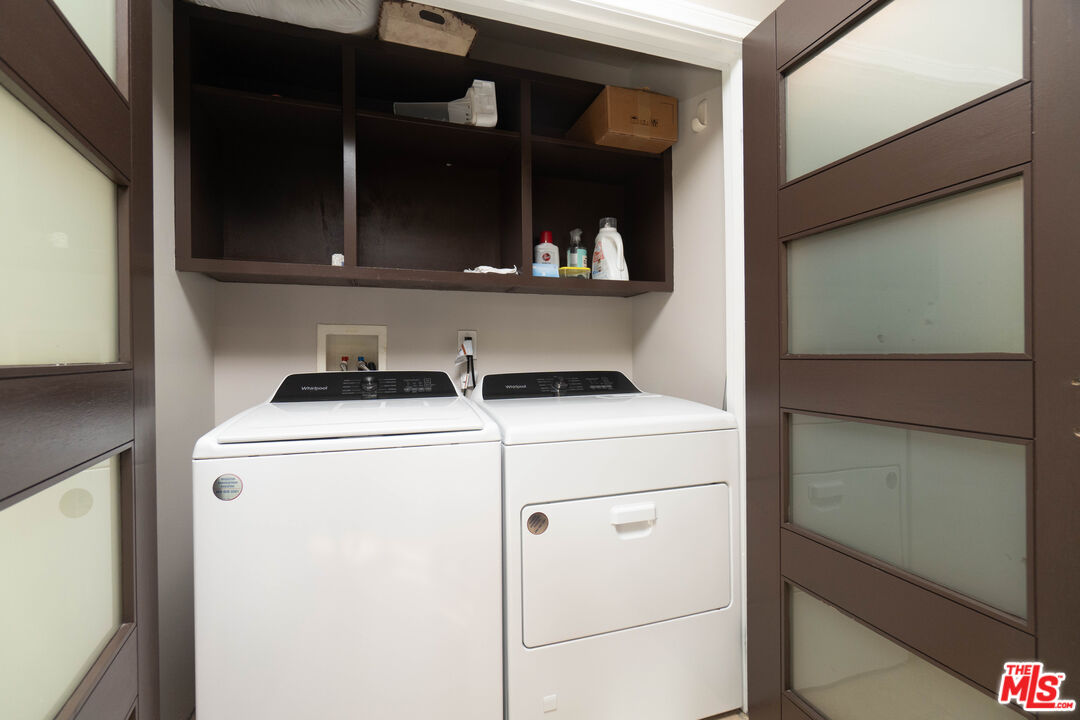 5181 Densmore Avenue Encino, CA 91436 - Photo 48 of 73 a utility room with dryer and washer