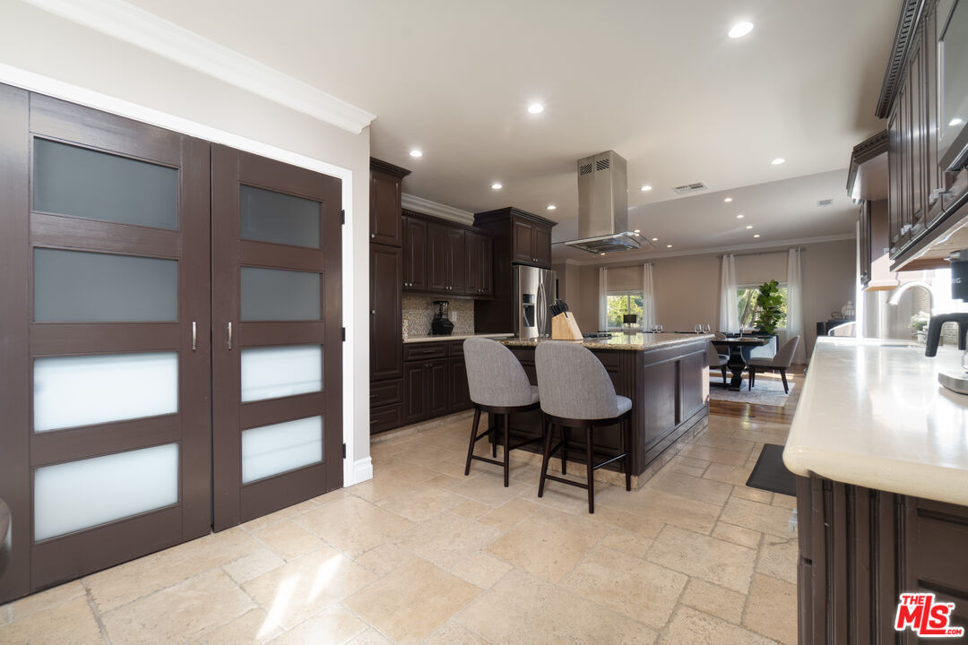 5181 Densmore Avenue Encino, CA 91436 - Photo 49 of 73 a living room with furniture and a large window