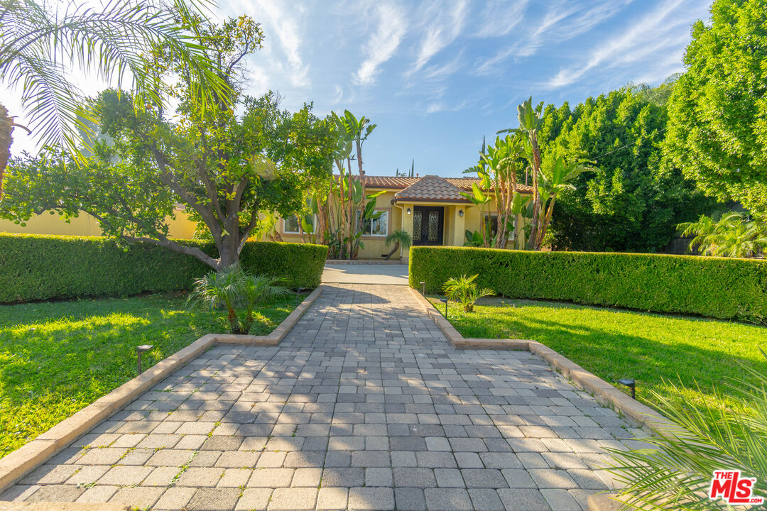 5181 Densmore Avenue Encino, CA 91436 - Photo 61 of 73 a front view of a house with garden