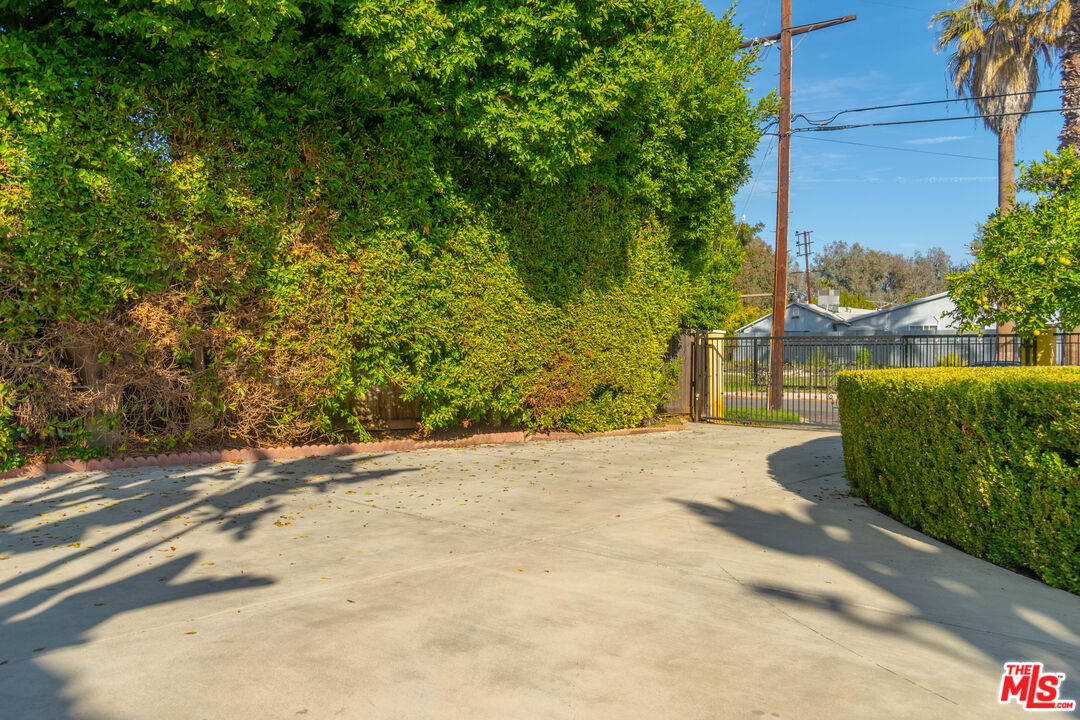 5181 Densmore Avenue Encino, CA 91436 - Photo 62 of 73 a view of a street with a building in the background