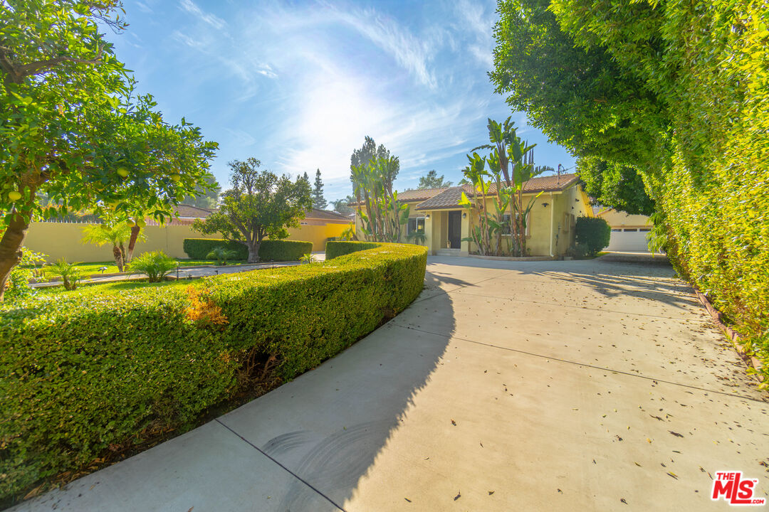 5181 Densmore Avenue Encino, CA 91436 - Photo 63 of 73 a view of a house with a yard and pathway