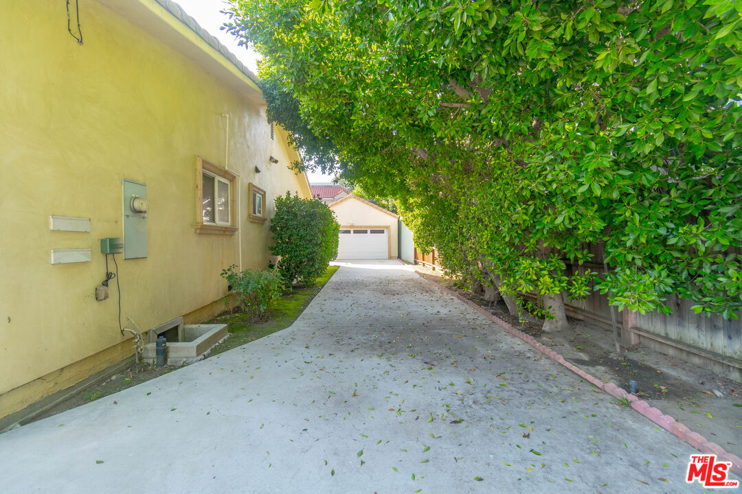 5181 Densmore Avenue Encino, CA 91436 - Photo 65 of 73 a view of a house with a backyard