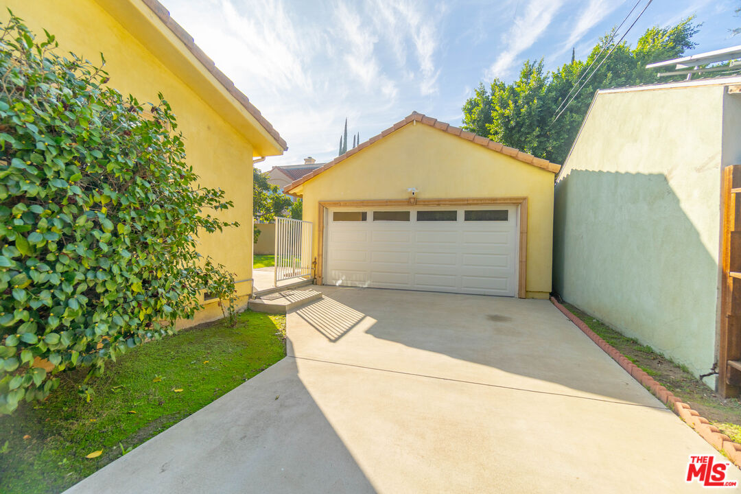 5181 Densmore Avenue Encino, CA 91436 - Photo 66 of 73 a front view of a house with a yard