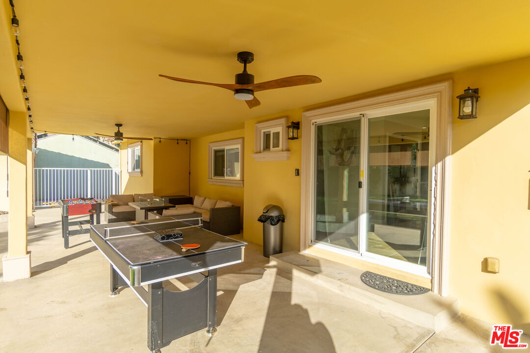 5181 Densmore Avenue Encino, CA 91436 - Photo 73 of 73 a living room with a couch and chandelier