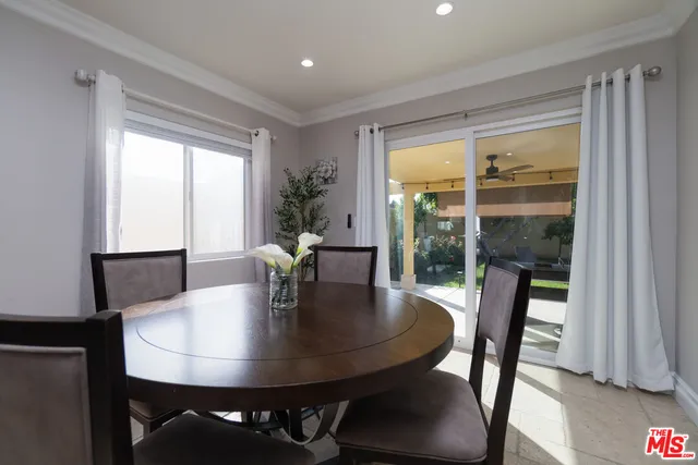 a room that has a bed and a table in it