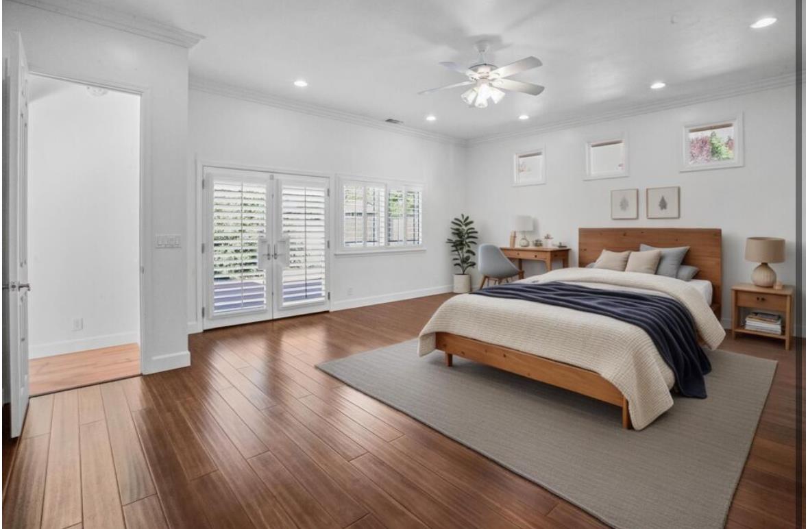 5852 Olive Ranch Road Granite Bay, CA 95746 - Photo 25 of 46 a spacious bedroom with a large bed and a chandelier