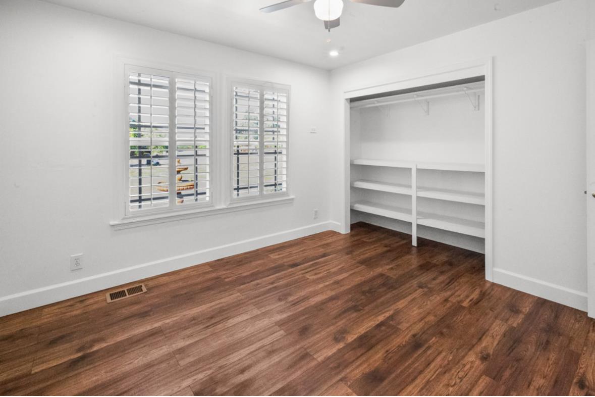5852 Olive Ranch Road Granite Bay, CA 95746 - Photo 33 of 46 a view of an empty room with a window and wooden floor