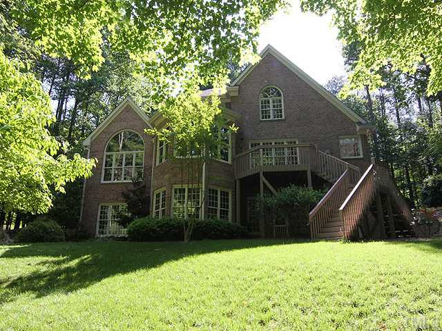 5809 Laurel Rock Lane Raleigh, NC 27613 - Photo 1 of 22 a front view of a house with a yard and green space
