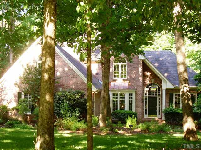 5809 Laurel Rock Lane Raleigh, NC 27613 - Photo 3 of 22 a front view of a house with garden