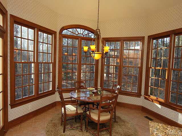 5809 Laurel Rock Lane Raleigh, NC 27613 - Photo 8 of 22 a view of a dining room with furniture window and outside view