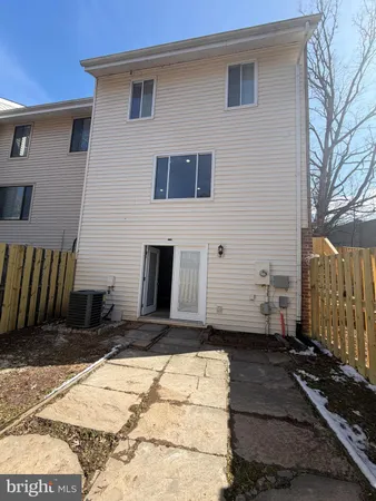 a side view of a house with a yard
