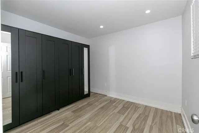 a view of hallway with wooden floor