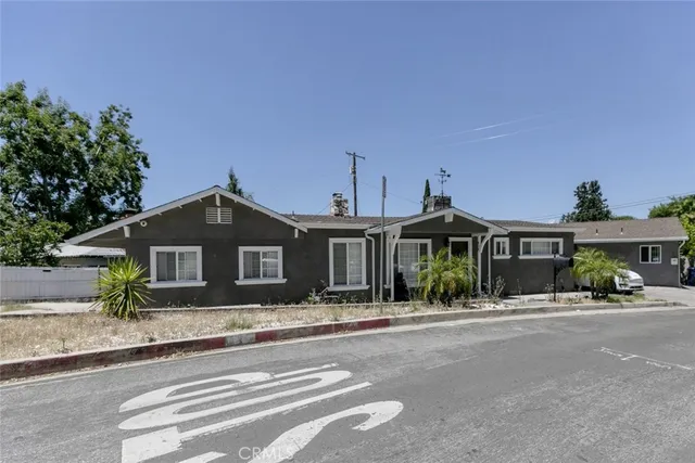 a front view of a house with a outdoor space