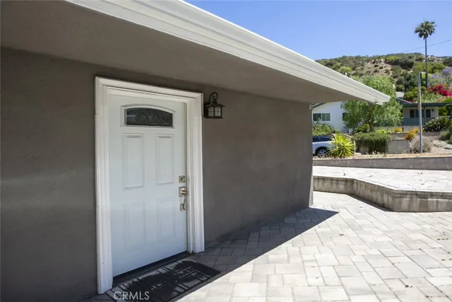 a view of balcony and car parked