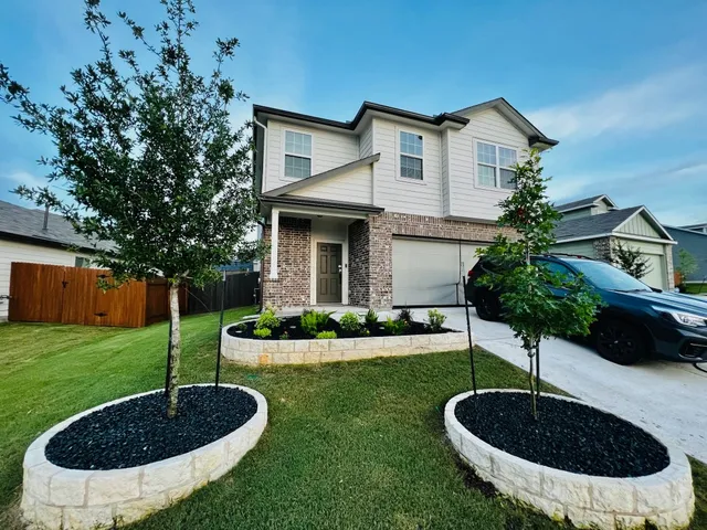 a front view of a house with garden
