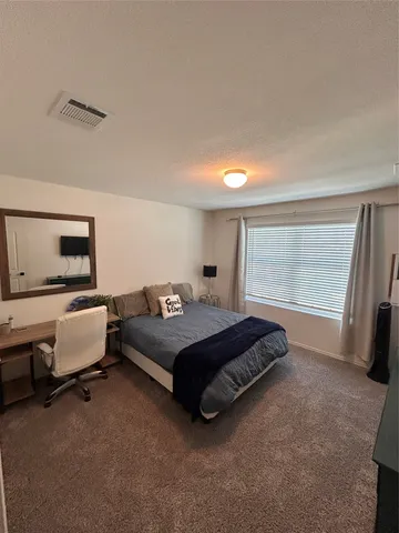 a view of a house with sitting area and furniture