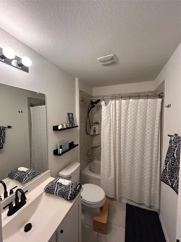 a room with furniture and air hockey table