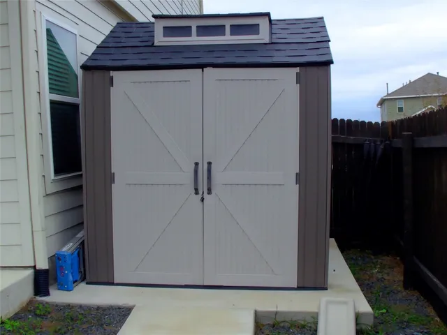 a view of a backyard with houses