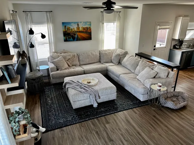 a kitchen with stainless steel appliances granite countertop a stove a sink a refrigerator and cabinets