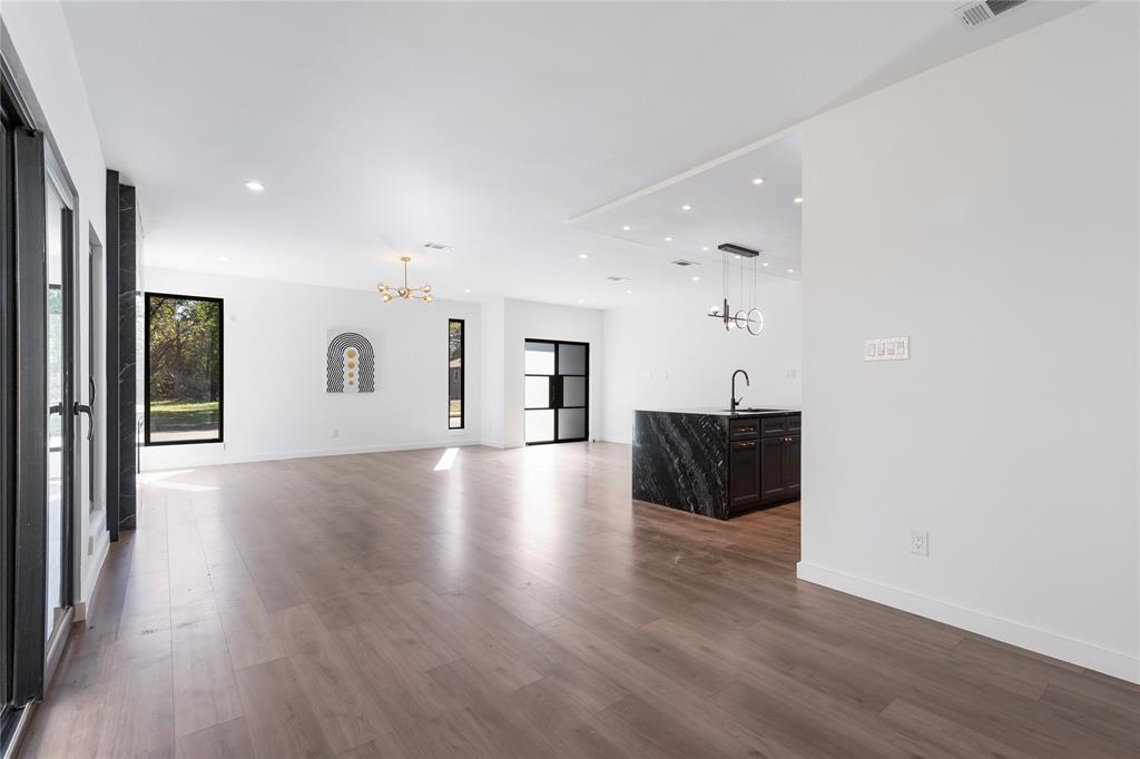 2535 Exline Street Dallas, TX 75215 - Photo 21 of 38 a view of a livingroom with wooden floor