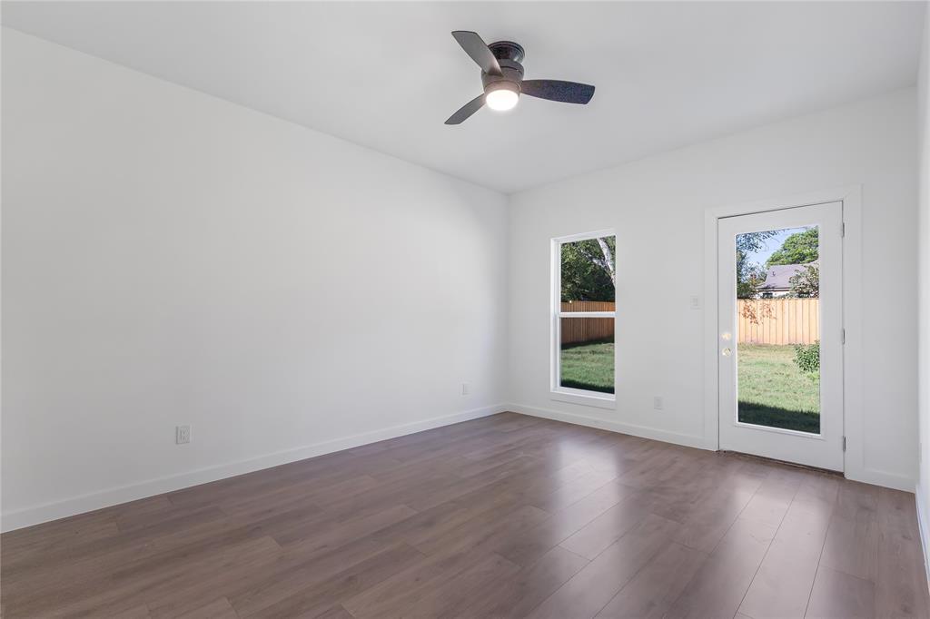 2535 Exline Street Dallas, TX 75215 - Photo 23 of 38 a view of empty room with wooden floor and fan