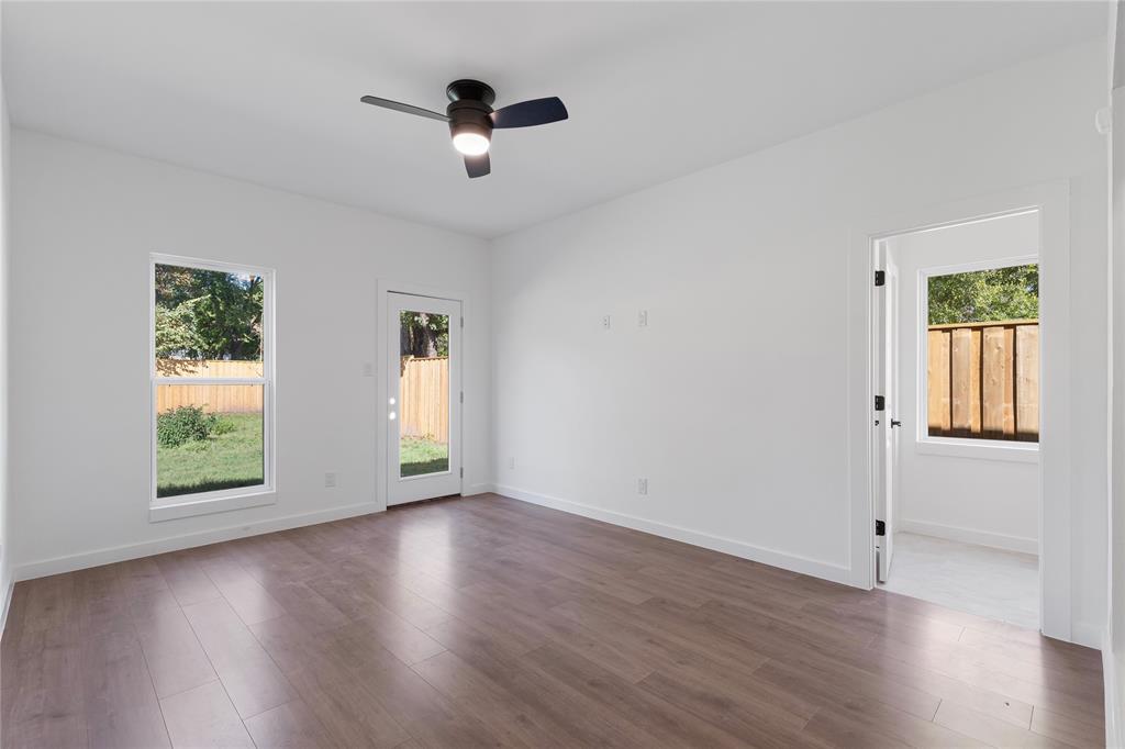 2535 Exline Street Dallas, TX 75215 - Photo 24 of 38 a view of an empty room with wooden floor and a window
