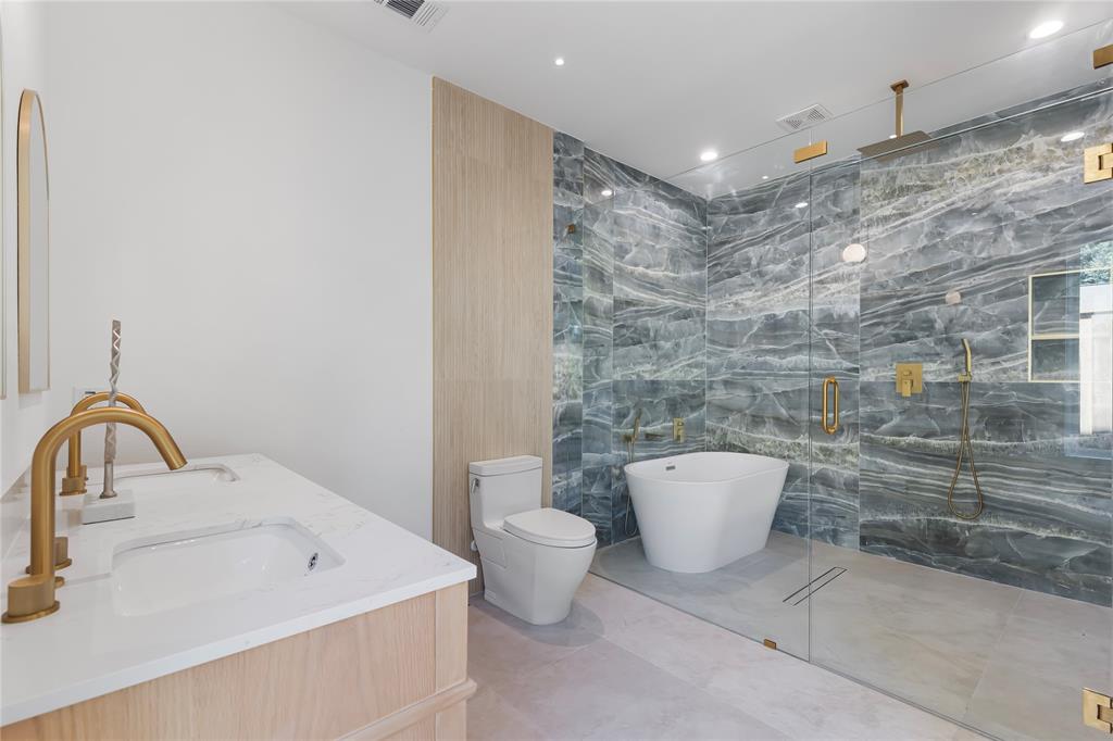 2535 Exline Street Dallas, TX 75215 - Photo 27 of 38 a bathroom with a sink and a mirror