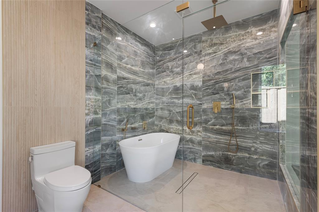 2535 Exline Street Dallas, TX 75215 - Photo 28 of 38 a bathroom with a toilet and a shower