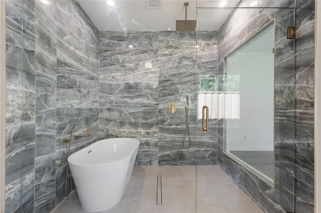 2535 Exline Street Dallas, TX 75215 - Photo 29 of 38 a bathroom with a bathtub and shower