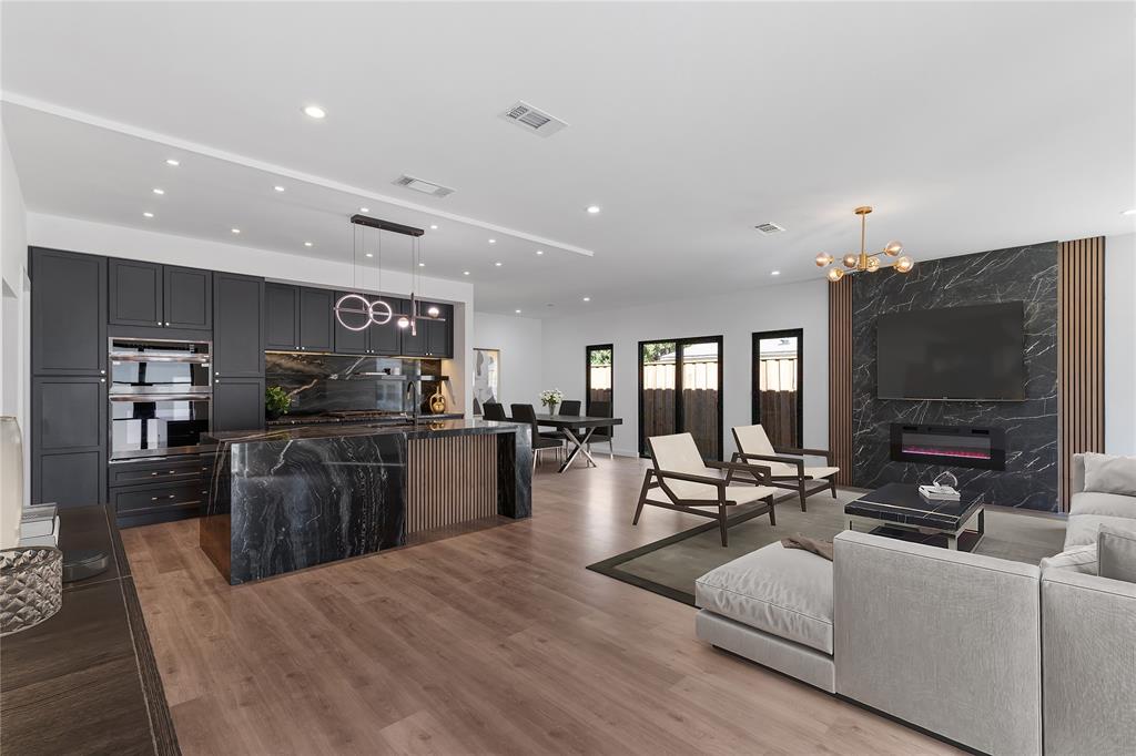 2535 Exline Street Dallas, TX 75215 - Photo 6 of 38 a living room with furniture flat screen tv and kitchen view