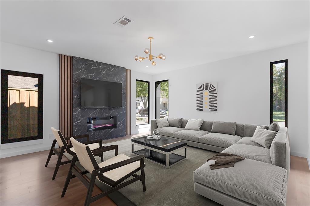 2535 Exline Street Dallas, TX 75215 - Photo 8 of 38 a living room with furniture a flat screen tv and a window