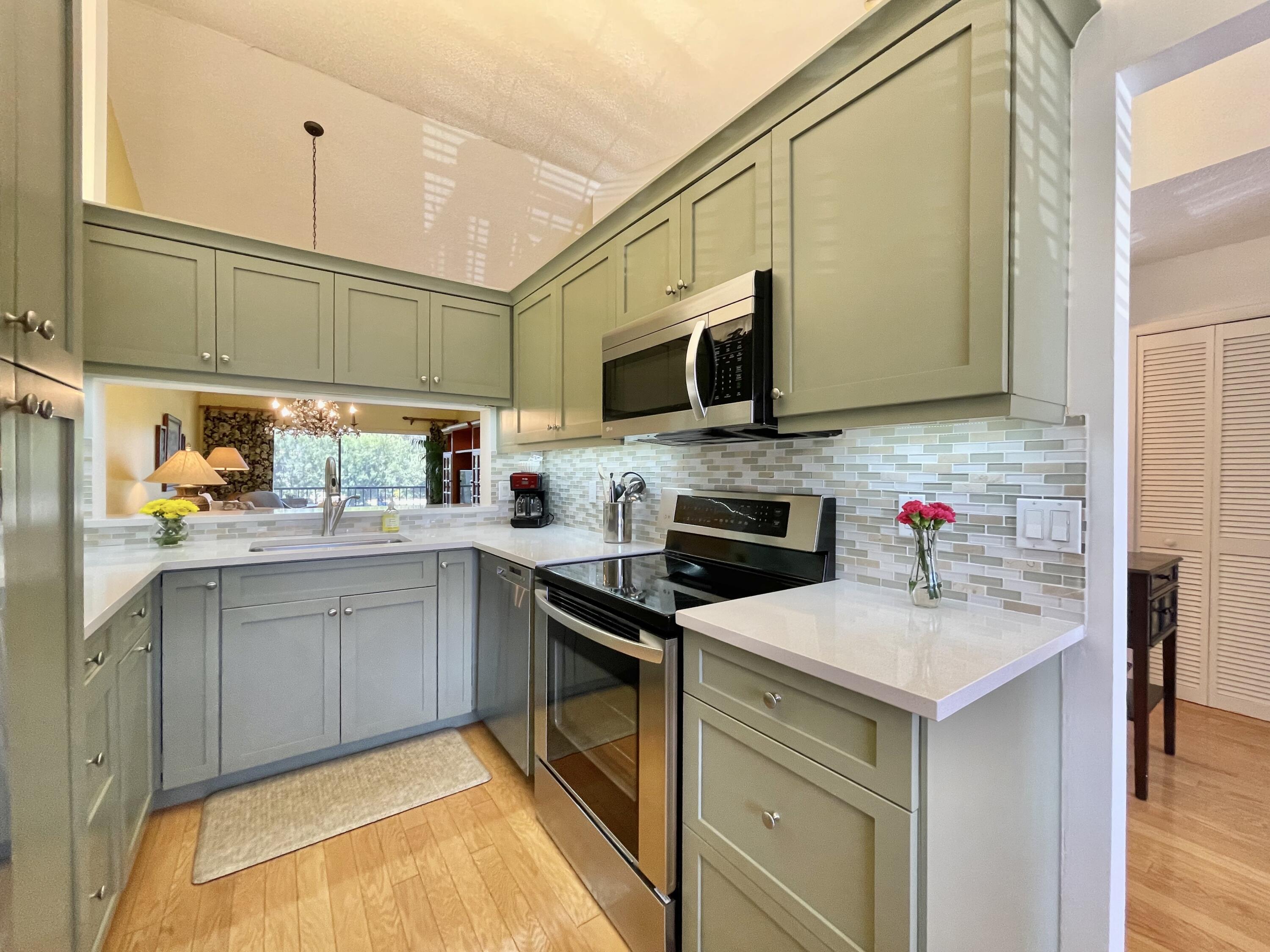 402 Pinecrest Circle, Unit B Jupiter, FL 33458 - Photo 9 of 45 Rich Wood Cabinets