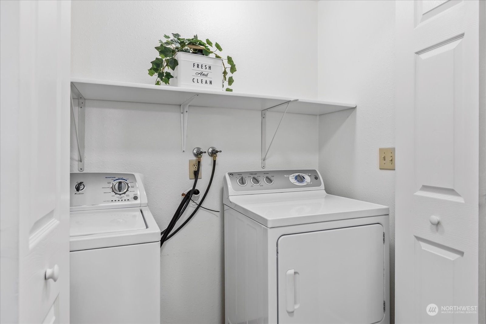 1302 224th Place Southwest Bothell, WA 98021 - Photo 16 of 32 a utility room with dryer and washer