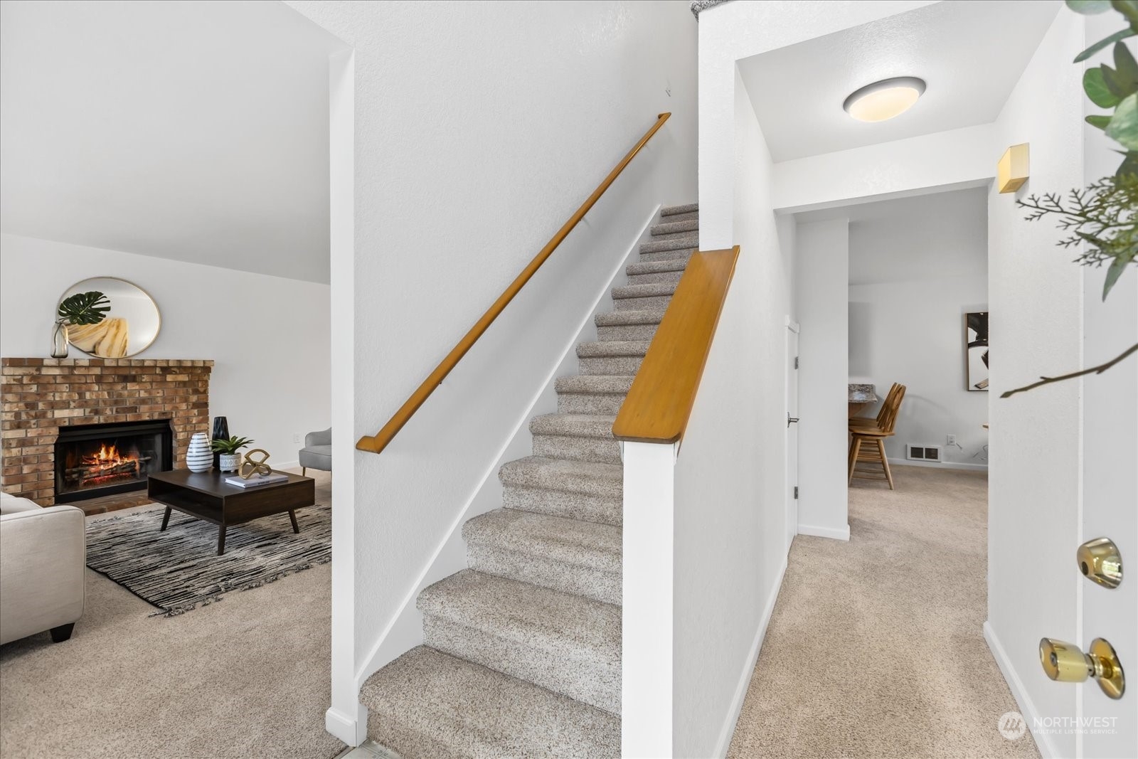 1302 224th Place Southwest Bothell, WA 98021 - Photo 17 of 32 a view of a livingroom with furniture and staircase