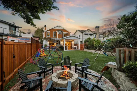 a view of a house with a yard and plants