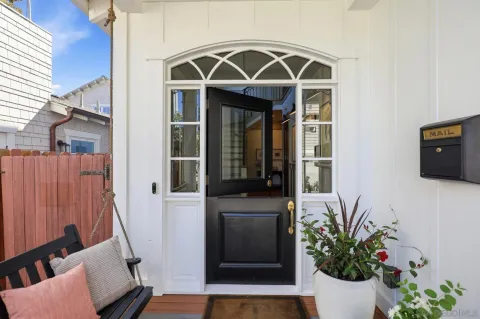 a view of entryway with wooden floor and stairs
