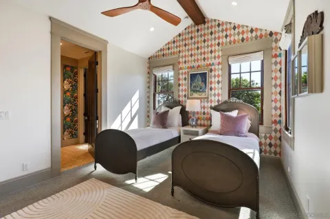 a bedroom with furniture and a window