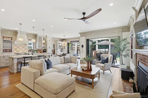 a large kitchen with lots of counter space dining table and stainless steel appliances