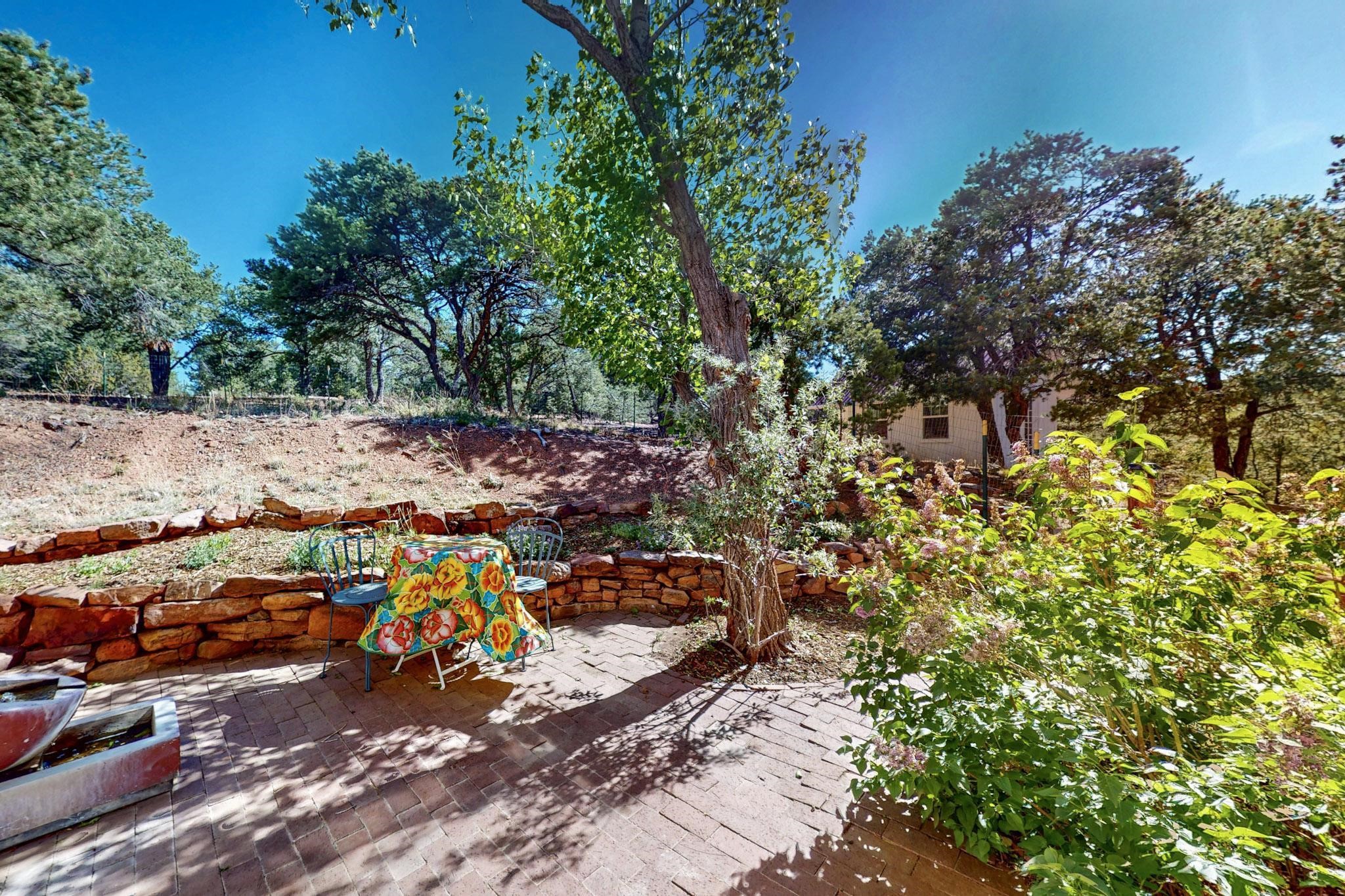 15 Toltec Road Santa Fe, NM 87505 - Photo 40 of 72 Side patio off living room. Studio beyond