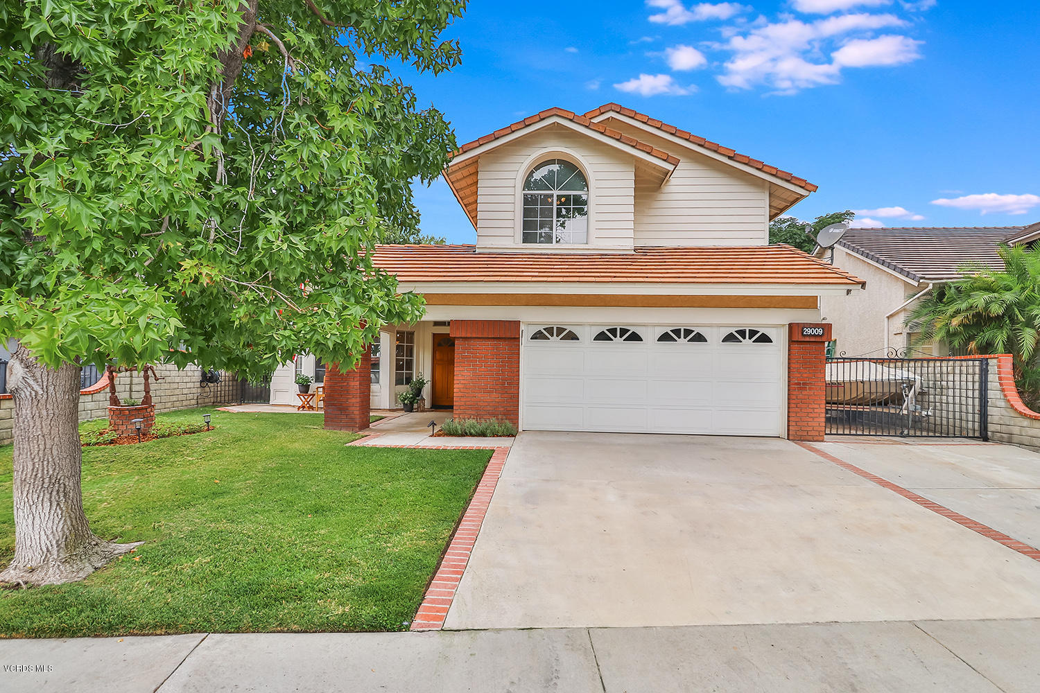 29009 Gumtree Place Saugus, CA 91390 - Photo 2 of 66 a front view of a house with a yard and garage