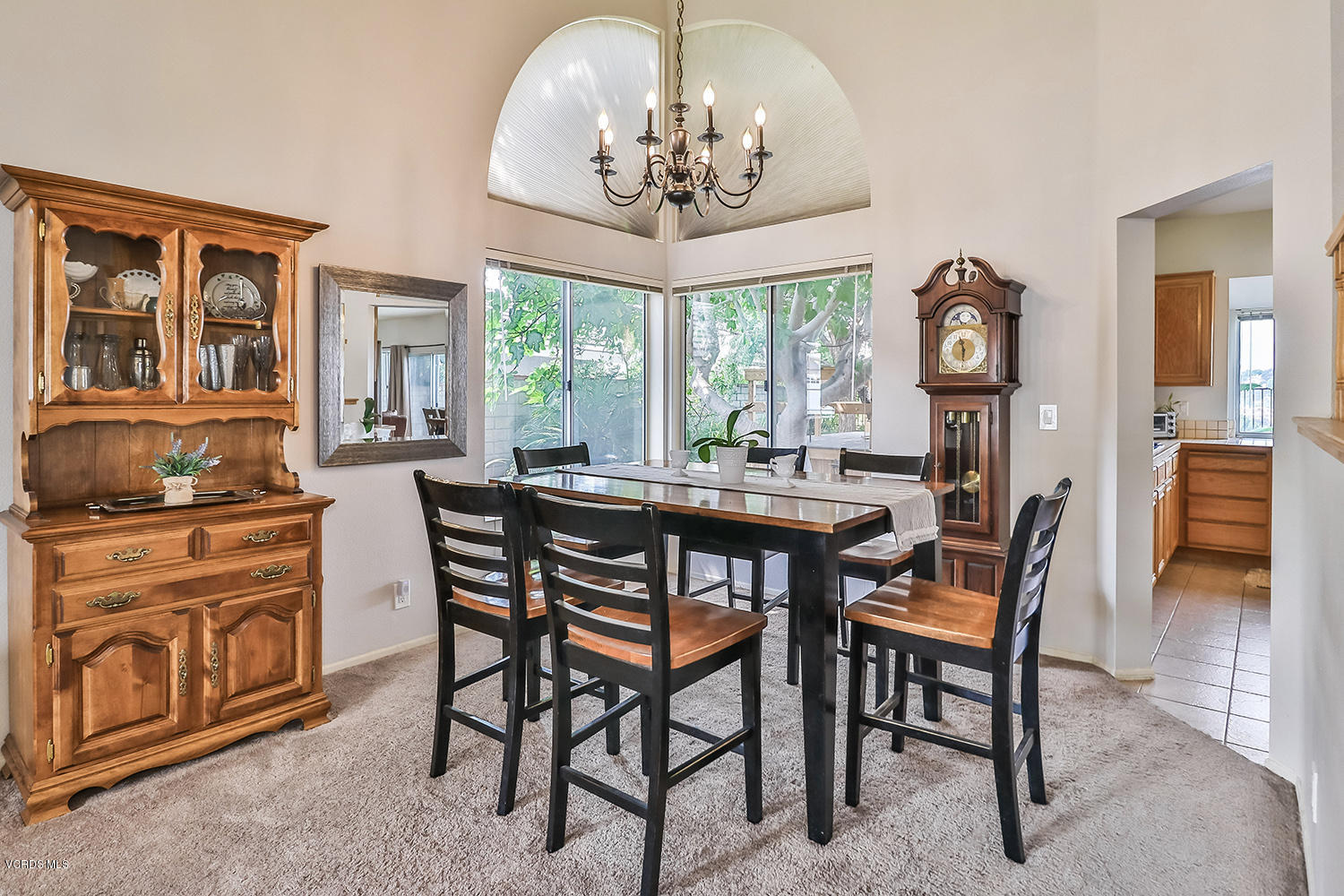 29009 Gumtree Place Saugus, CA 91390 - Photo 11 of 66 a dining room with furniture a chandelier and a rug