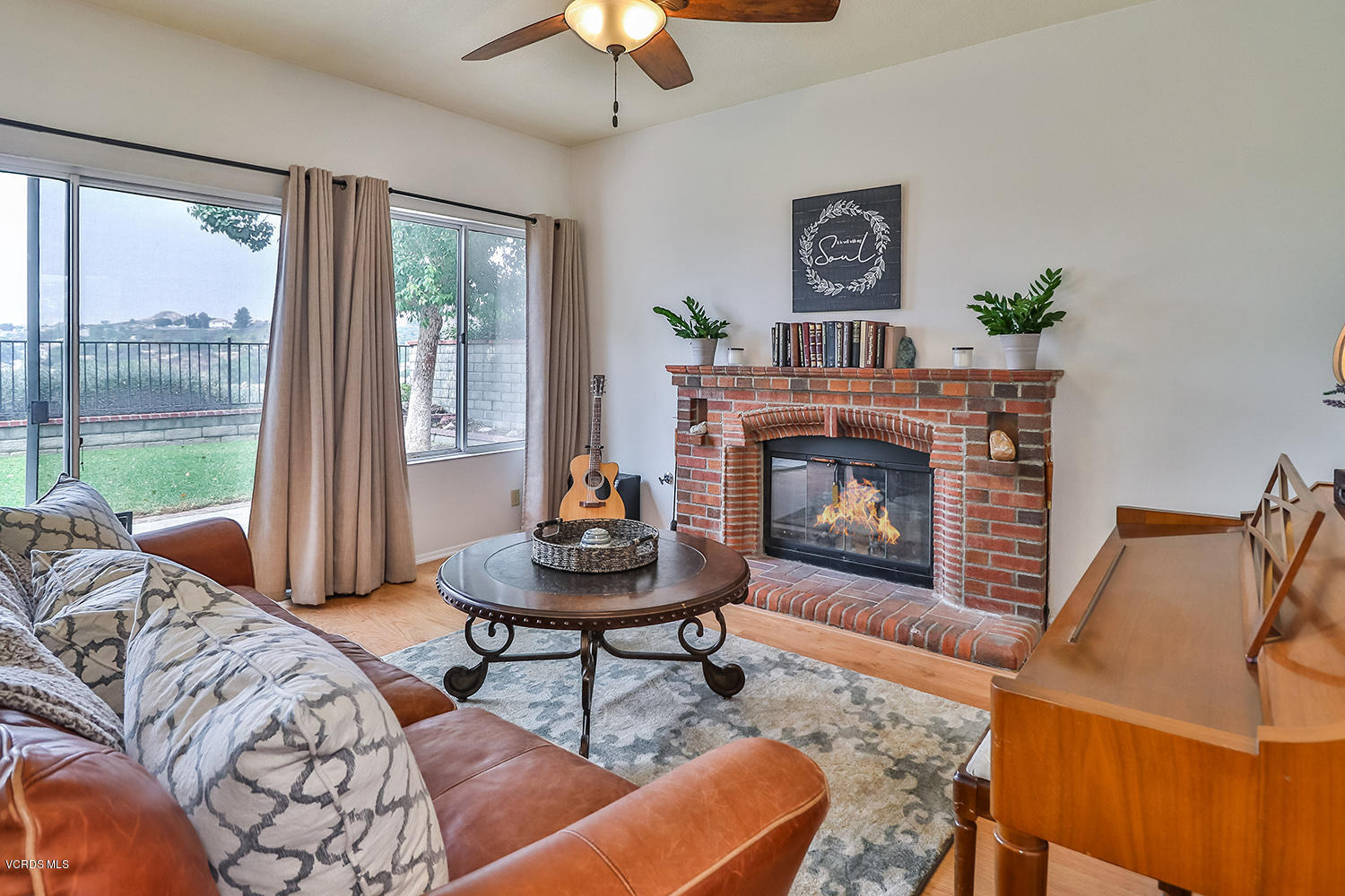 29009 Gumtree Place Saugus, CA 91390 - Photo 18 of 66 a living room with furniture a table and a fireplace