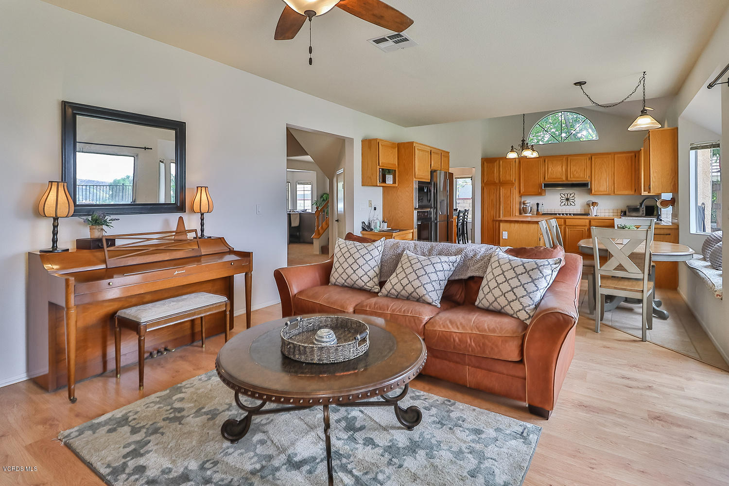 29009 Gumtree Place Saugus, CA 91390 - Photo 19 of 66 a living room with furniture a rug and a chandelier