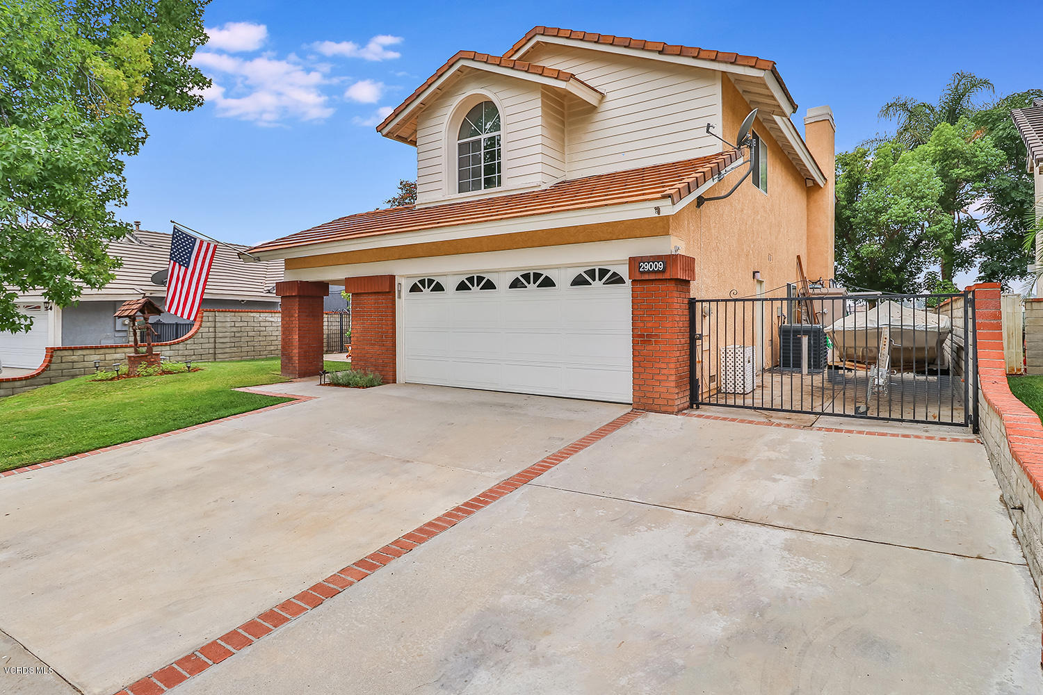 29009 Gumtree Place Saugus, CA 91390 - Photo 3 of 66 a front view of a house with a yard and garage